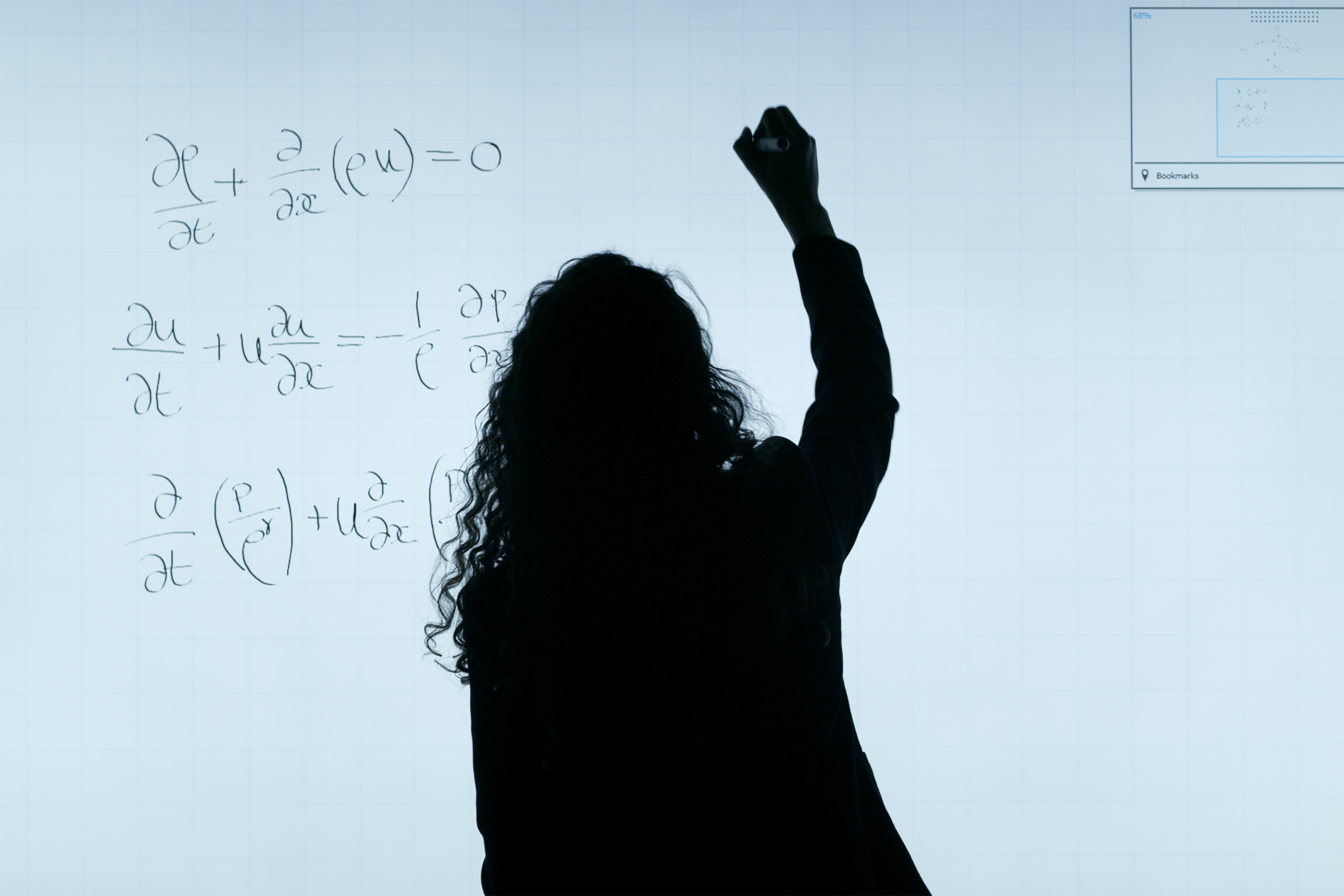 woman writing mathematical  equation